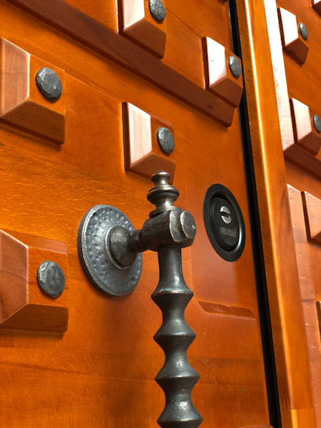 Wooden security doors have some kind of bullet-resistant material in their core.